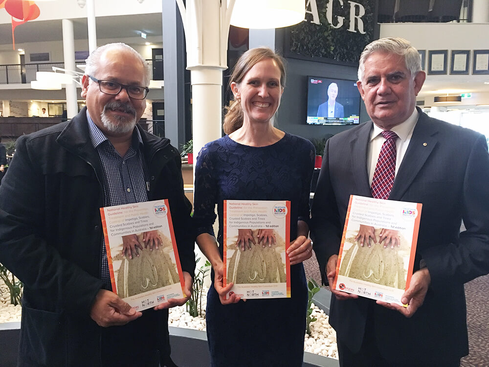 Glenn Pearson, Dr Asha Bowen & Hon Ken Wyatt MP, holding the Healthy Ski Guideline